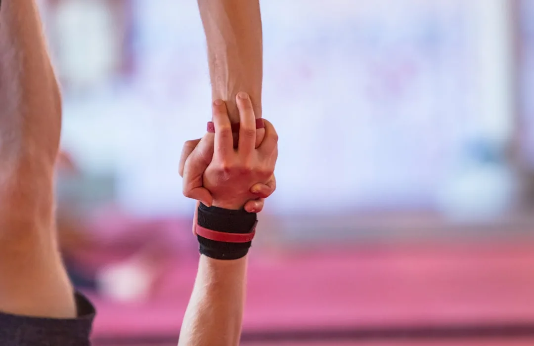 Kyool athletes putting hands together in teamwork and mutual support